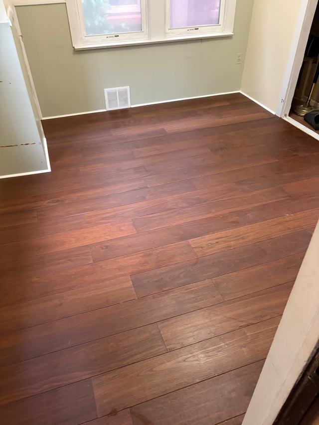 After: finished room with new wood plank flooring